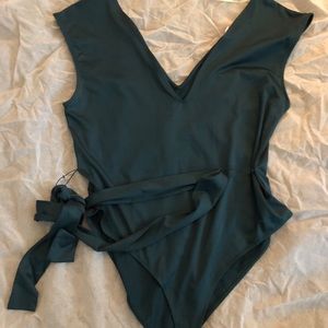Green one piece body suite